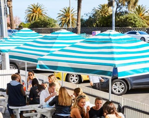 Espy Hotel with striped cafe series umbrellas