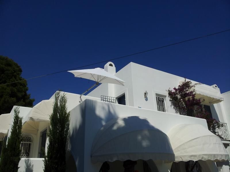 Residential wall mounted umbrella